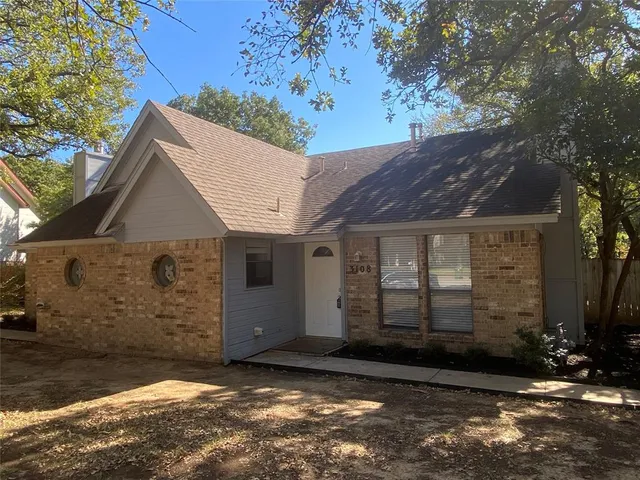 a view of a house with a tree