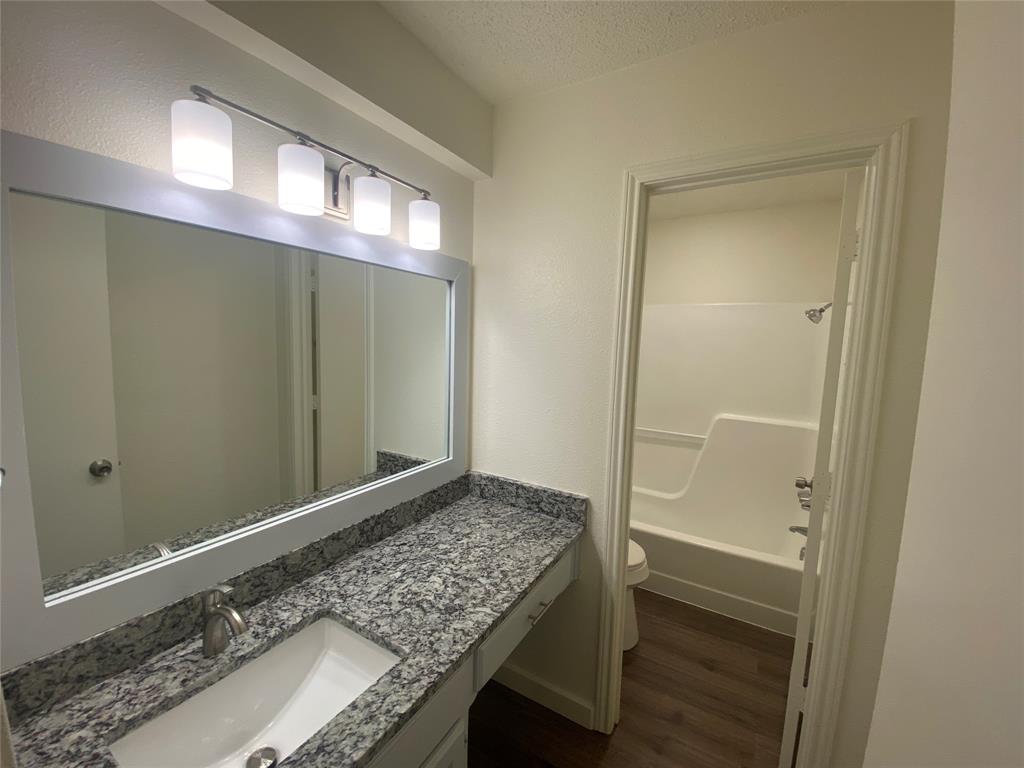 3108 Timber Ridge Point Grapevine, TX 76051 - Photo 16 of 16 a bathroom with a sink and a mirror