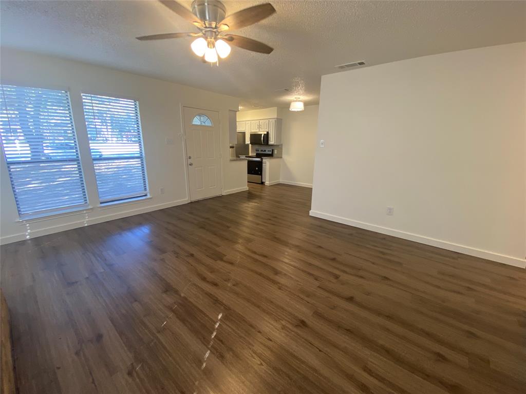 3108 Timber Ridge Point Grapevine, TX 76051 - Photo 4 of 16 a view of empty room with wooden floor and fan