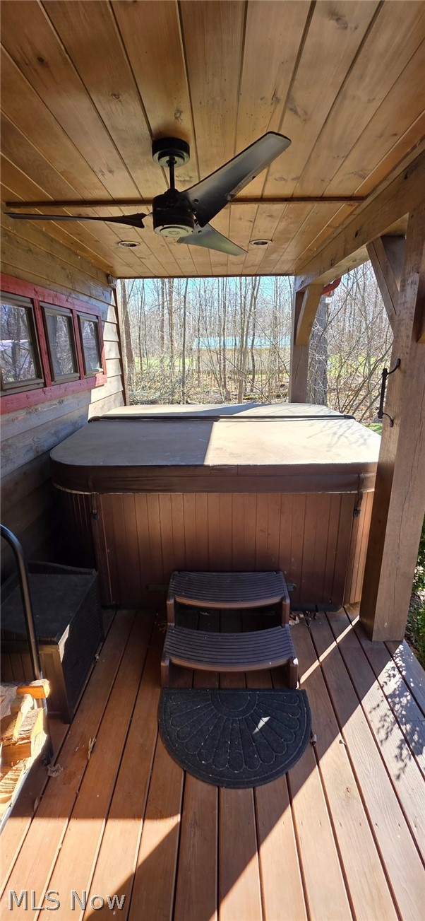 3989 Court Road Wakeman, OH 44889 - Photo 30 of 36 Deck featuring a hot tub and ceiling fan