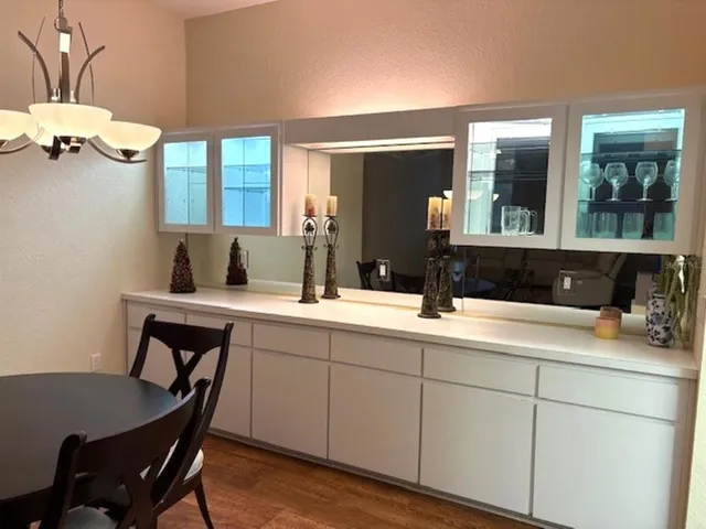 a spacious bathroom with a double vanity sink and a mirror
