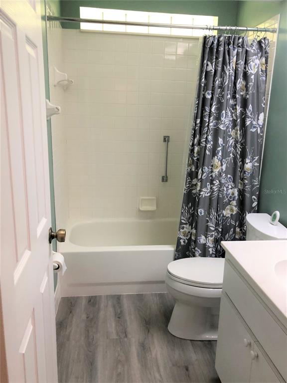 7867 Southwest 115th Loop Ocala, FL 34476 - Photo 21 of 40 a bathroom with a toilet and a shower