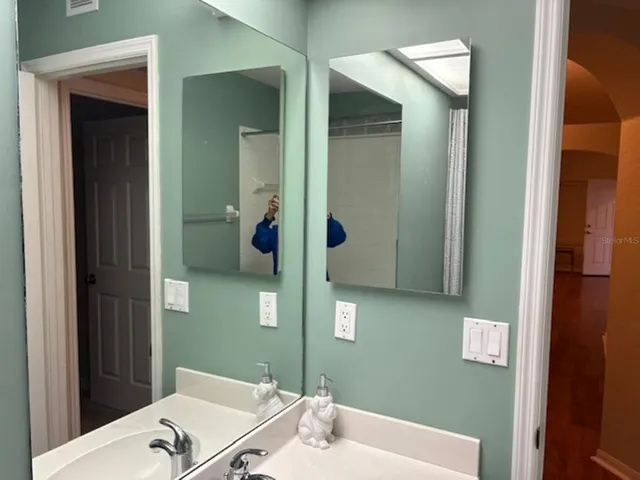 a bathroom with a bathtub and a sink