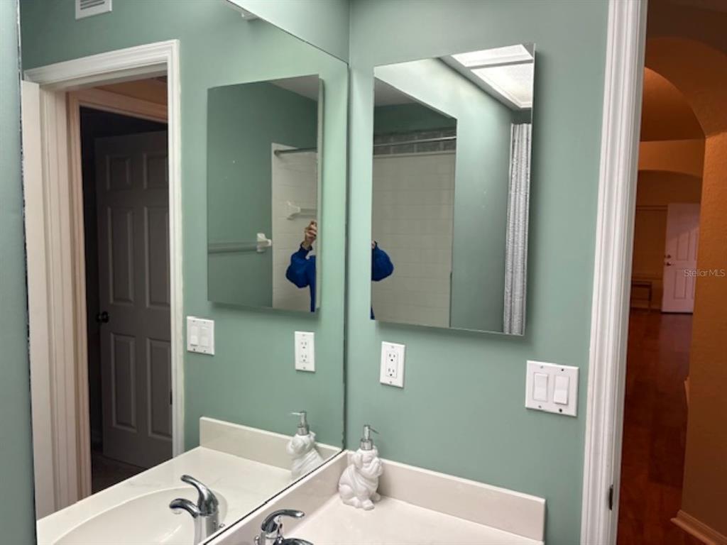 7867 Southwest 115th Loop Ocala, FL 34476 - Photo 24 of 40 a bathroom with a bathtub and a sink