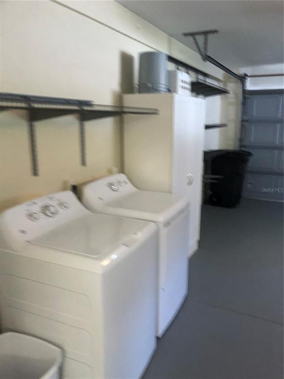 7867 Southwest 115th Loop Ocala, FL 34476 - Photo 39 of 40 a utility room with dryer and washer