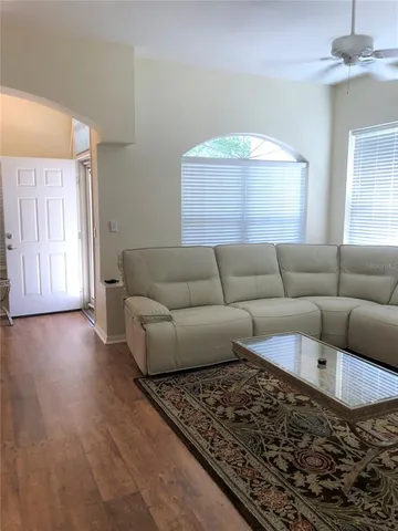 a living room with furniture and a window