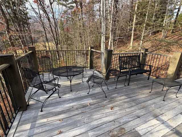 a view of a chairs and table in patio