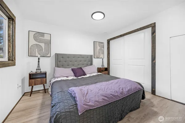 a bedroom with a bed and a table in it