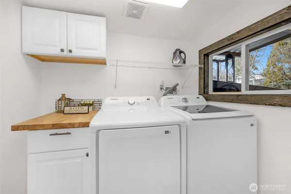 a utility room with dryer and washer