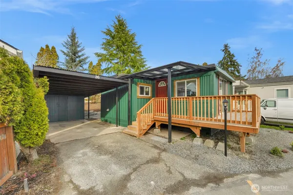 a backyard of a house with a deck