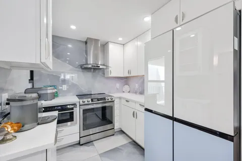 a kitchen with a stove and a sink
