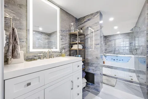 a bathroom with a bathtub and a sink