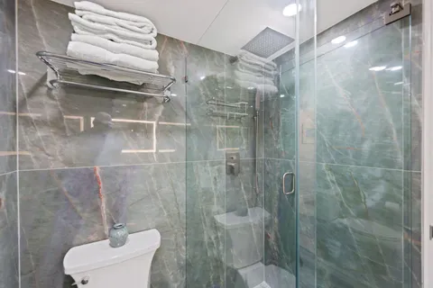 a view of a balcony with chairs