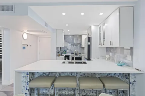 a kitchen with a stove and a refrigerator