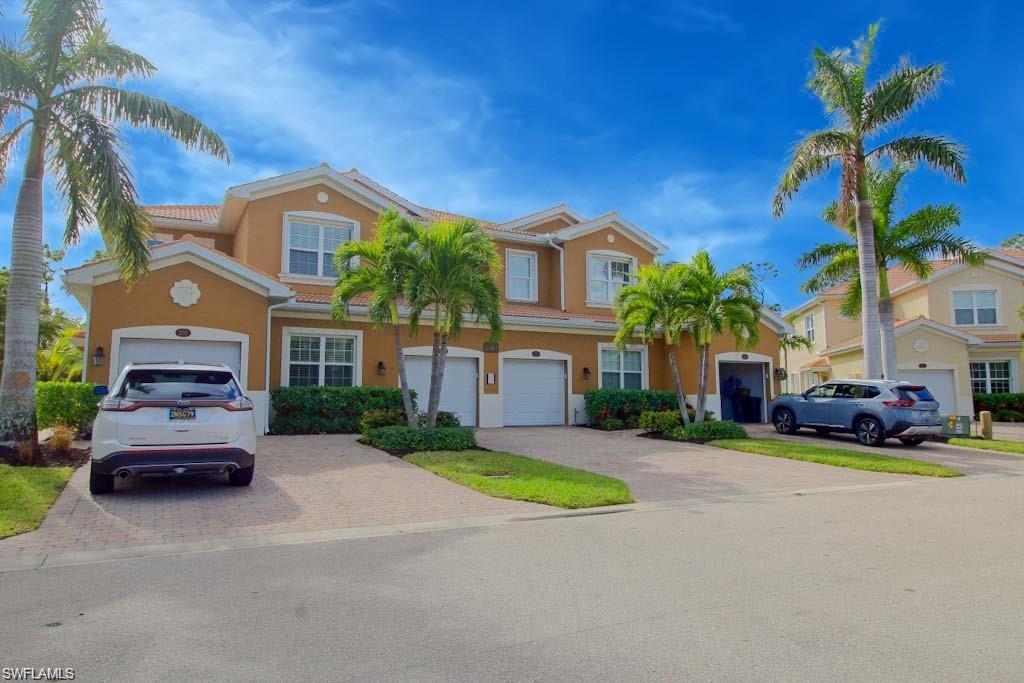 18324 Creekside Preserve Loop, Unit 101 Fort Myers, FL 33908 - Photo 1 of 10 a car parked in front of a house