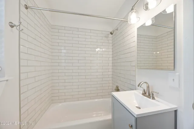 a bathroom with a bathtub and sink
