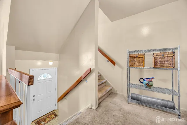 a view of entryway with bedroom and stairs