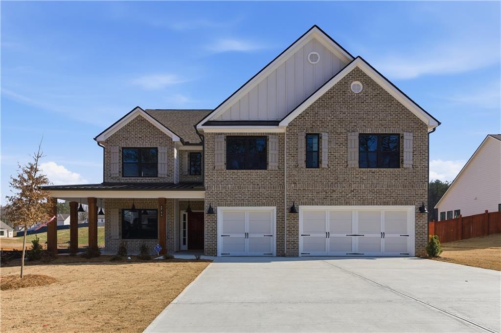 4749 Cooling Water Circle Powder Springs, GA 30127 - Photo 1 of 35 a front view of house with yard