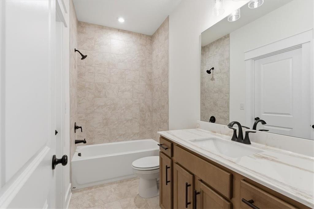 4749 Cooling Water Circle Powder Springs, GA 30127 - Photo 22 of 35 a bathroom with a sink a toilet and shower
