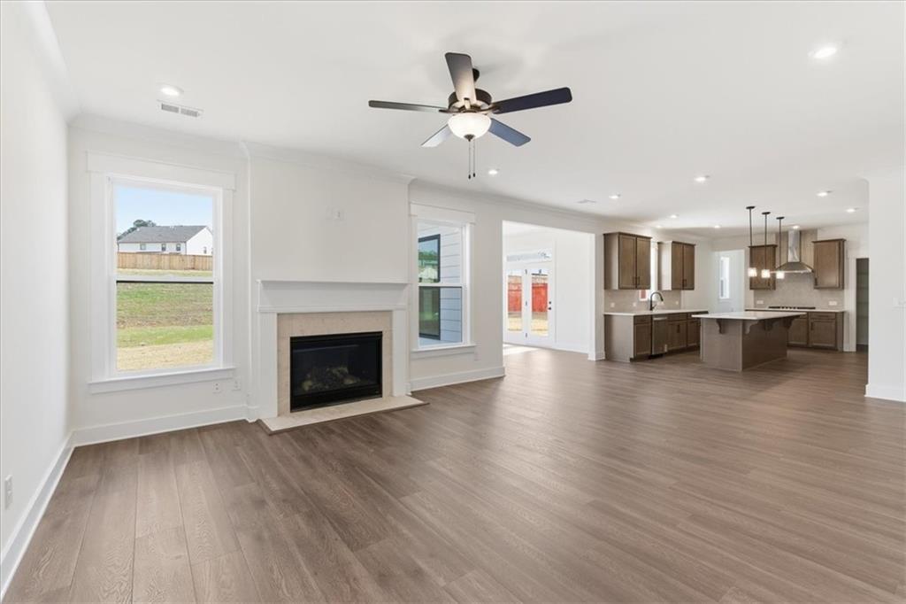 4749 Cooling Water Circle Powder Springs, GA 30127 - Photo 4 of 35 a view of a room with kitchen and fireplace