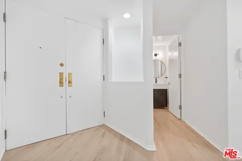 wooden floor in a hall with an entryway