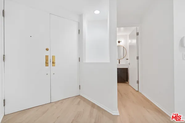 wooden floor in a hall with an entryway