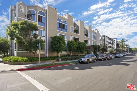 a car parked in front of a brick building