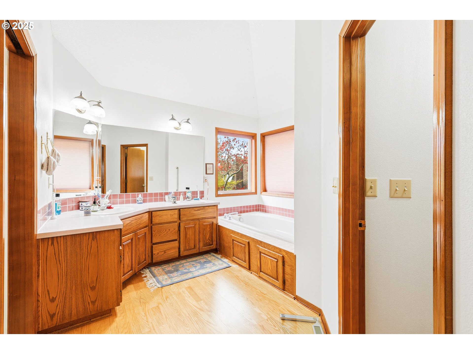 16395 Southwest Sumac Street Beaverton, OR 97007 - Photo 11 of 33 a bathroom with a tub sink and mirror