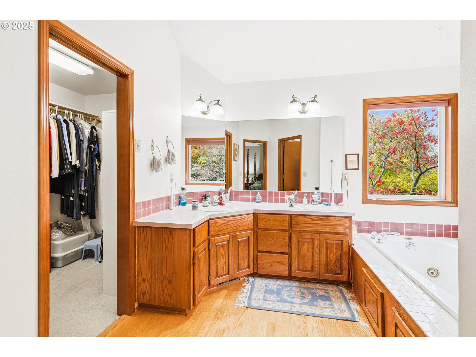 16395 Southwest Sumac Street Beaverton, OR 97007 - Photo 12 of 33 a large bathroom with a tub double vanity sink and a mirror
