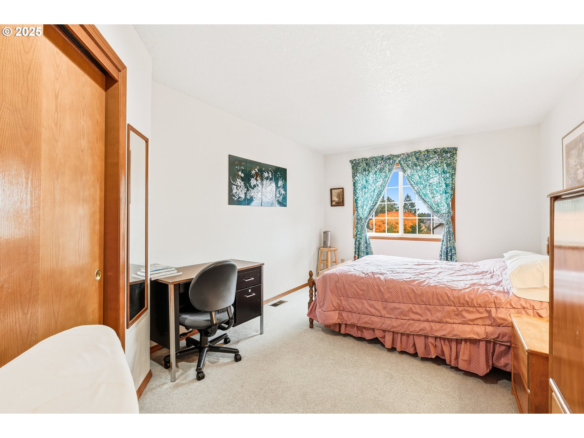 16395 Southwest Sumac Street Beaverton, OR 97007 - Photo 15 of 33 a bedroom with a bed chair and window