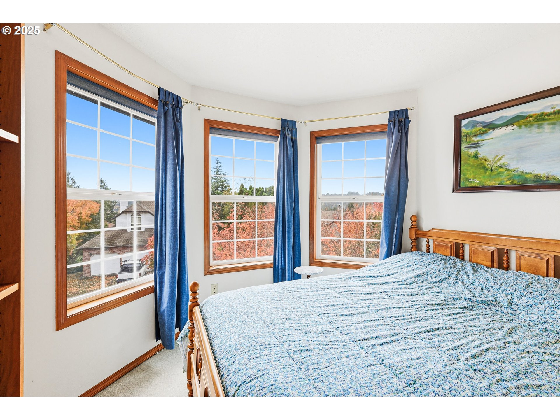 16395 Southwest Sumac Street Beaverton, OR 97007 - Photo 17 of 33 a bedroom with a bed and a large window