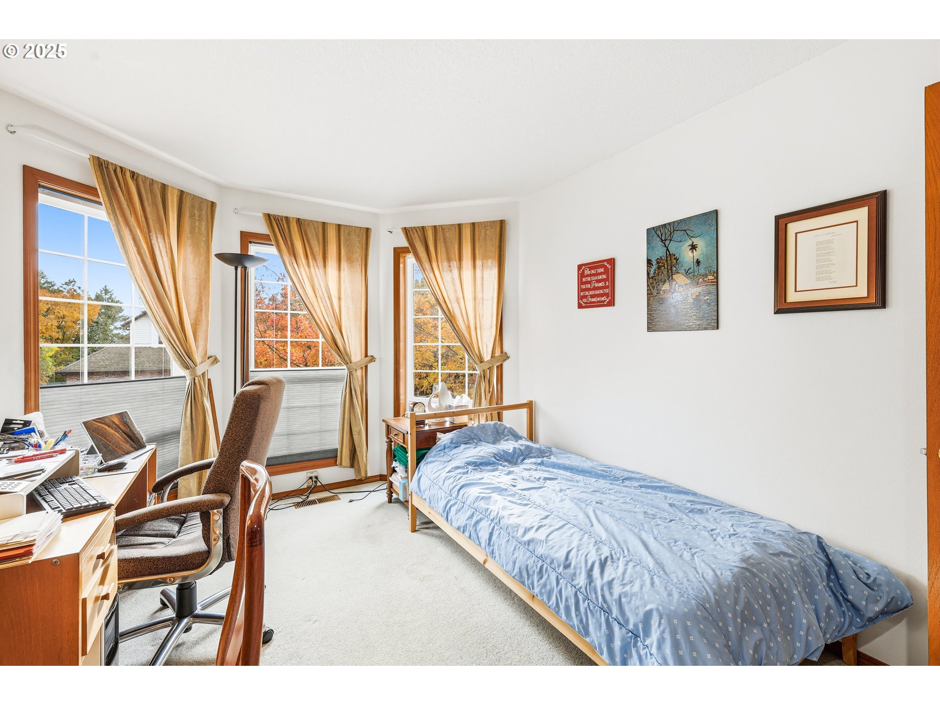 16395 Southwest Sumac Street Beaverton, OR 97007 - Photo 20 of 33 a bedroom with a bed and a night stand next to a window