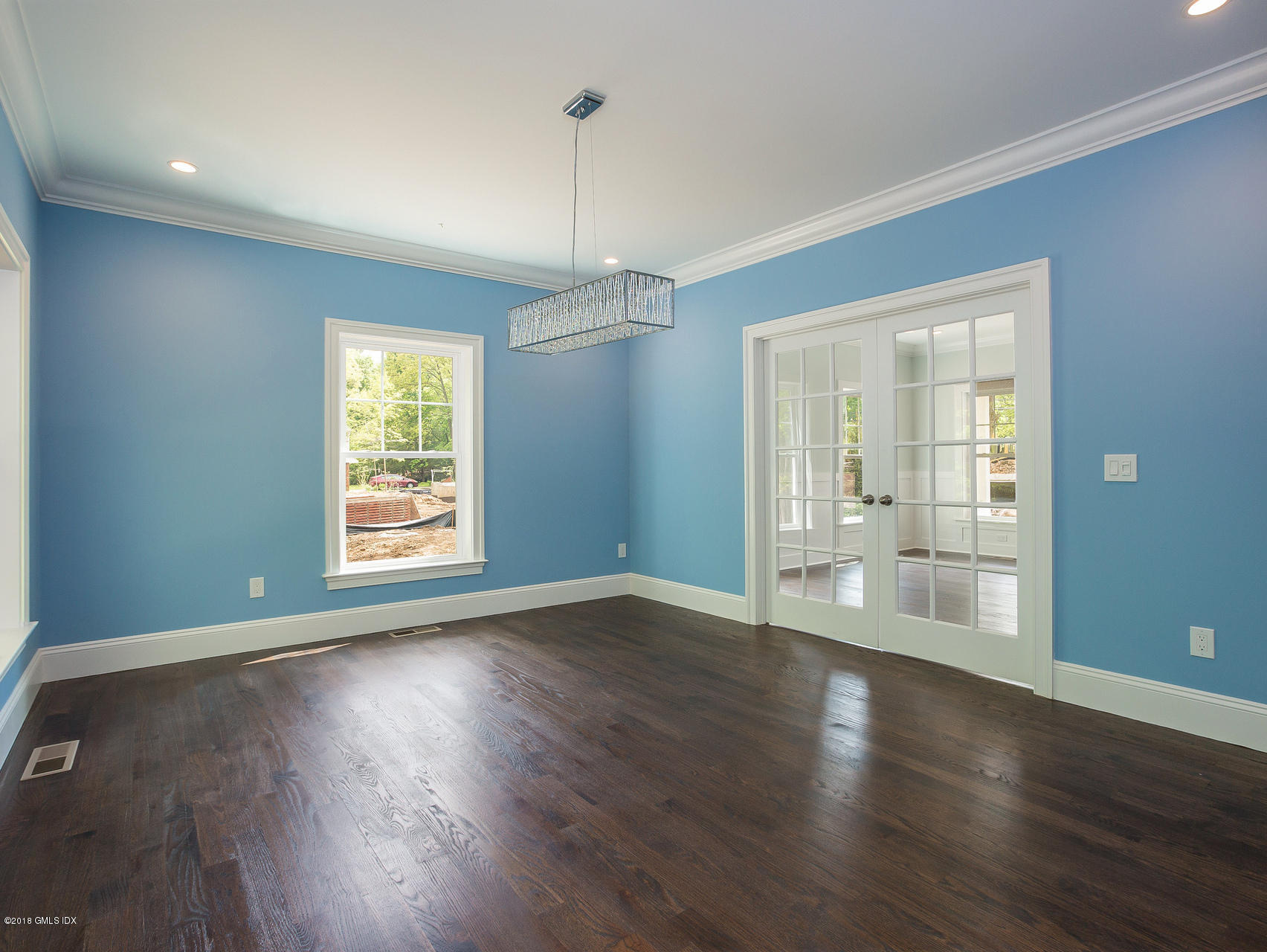 1041 Stillwater Road Stamford, CT 06902 - Photo 13 of 41 an empty room with wooden floor and windows