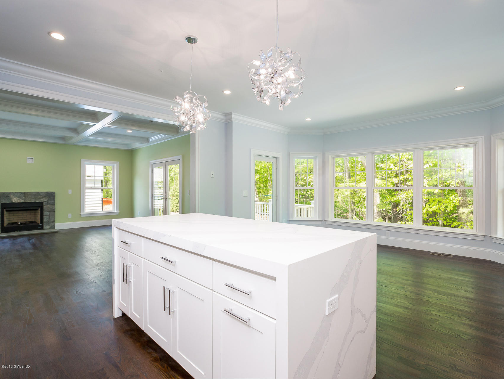 1041 Stillwater Road Stamford, CT 06902 - Photo 15 of 41 a view of a kitchen center island and wooden floor