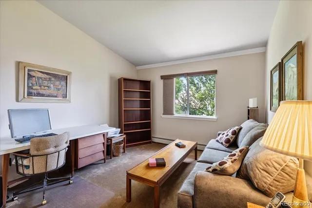 a bedroom with furniture and a window