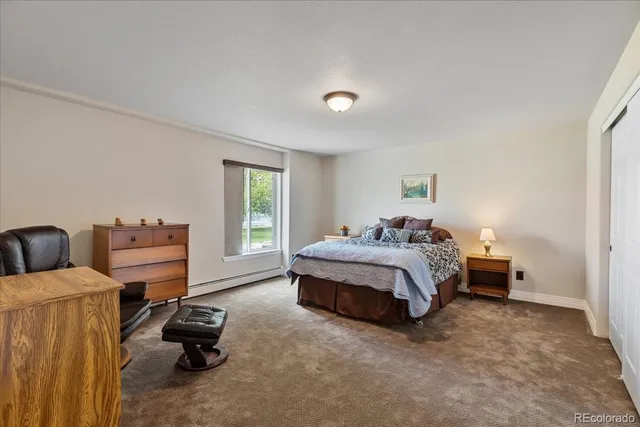 a bed room with a bed and a view