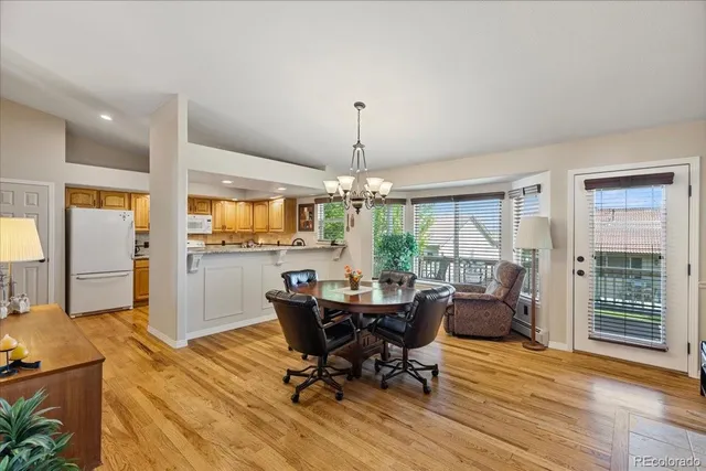 a view of a dining room with furniture window and outside view