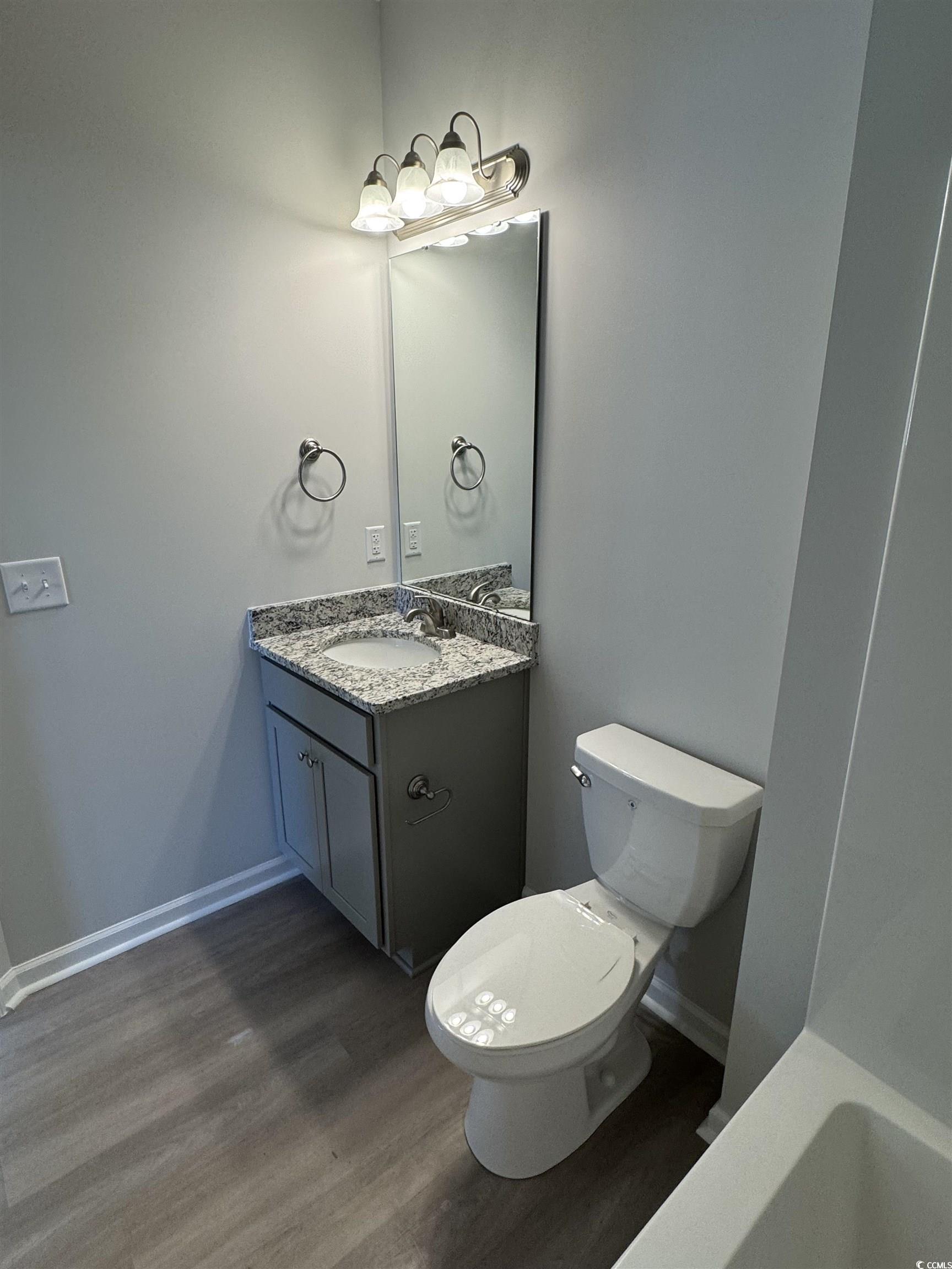 600 Shallow Cv Drive Conway, SC 29527 - Photo 12 of 14 Full bathroom with dark wood-type flooring, vanity
