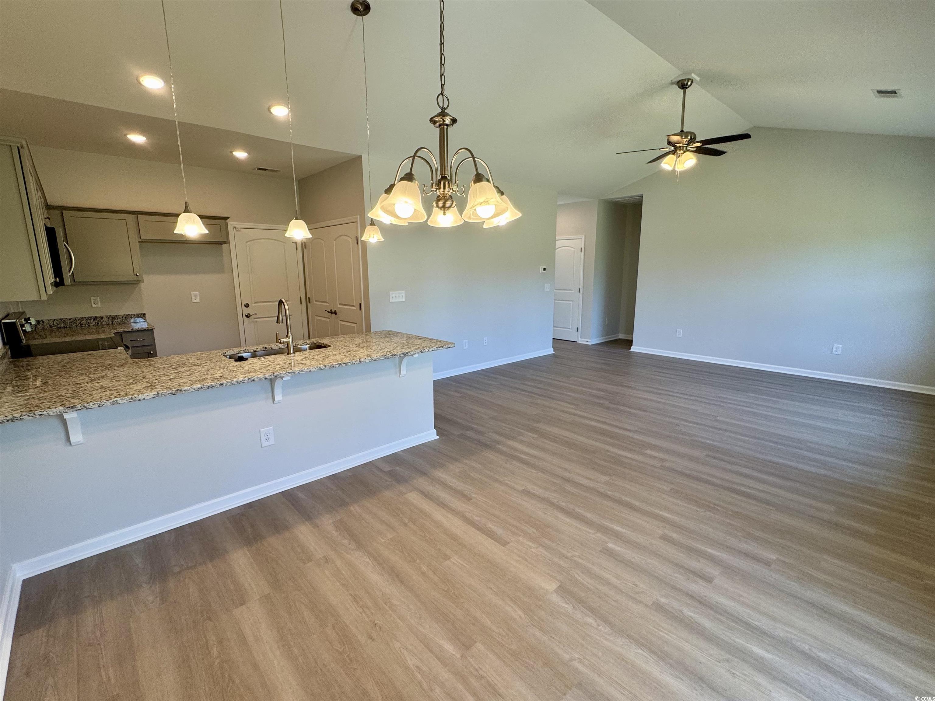 600 Shallow Cv Drive Conway, SC 29527 - Photo 4 of 14 Kitchen featuring a kitchen breakfast bar, light s