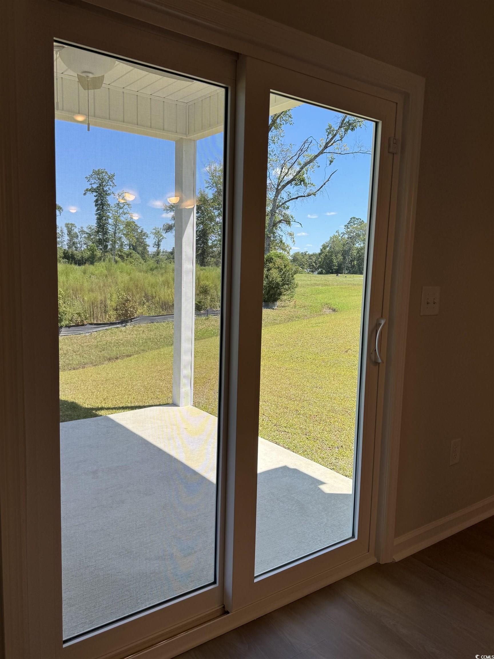 600 Shallow Cv Drive Conway, SC 29527 - Photo 5 of 14 Doorway to outside featuring wood finished floors