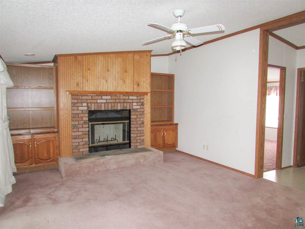 7561 Industrial Road Saginaw, MN 55779 - Photo 5 of 24 Wood burning fireplace never used