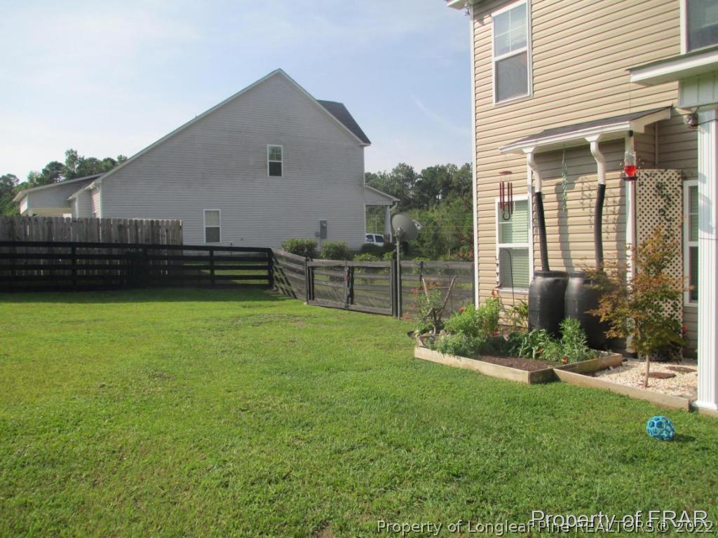 5028 Aberdeen Road Raeford, NC 28376 - Photo 5 of 34 a front view of a house with a yard