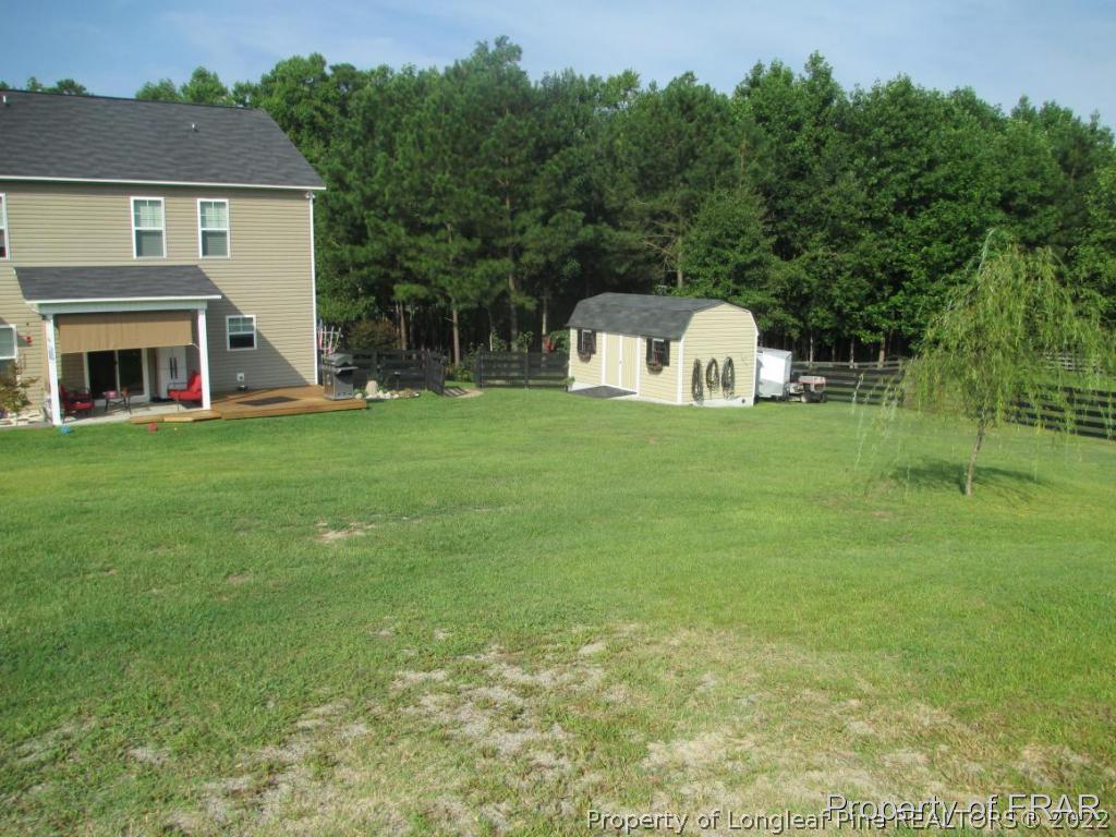 5028 Aberdeen Road Raeford, NC 28376 - Photo 6 of 34 a front view of a house with a garden