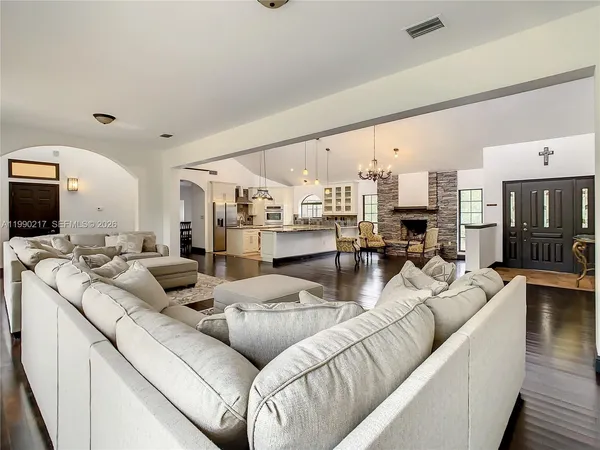a living room with furniture and a fireplace