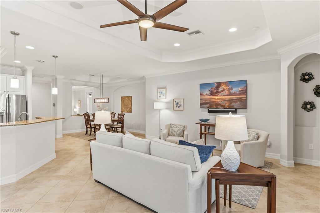 12614 Fenhurst Way Naples, FL 34120 - Photo 6 of 44 Open living to kitchen/dining area