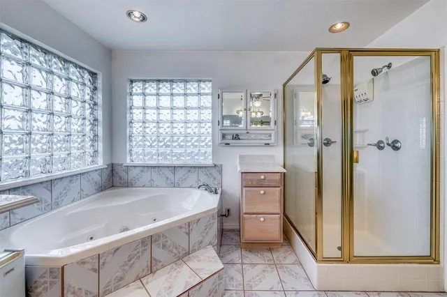 a kitchen with a stove a sink a microwave a dining table and chairs