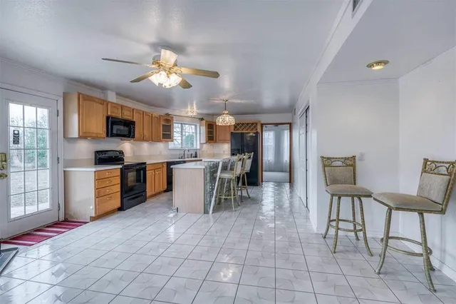 a view of a room with gym equipment and windows