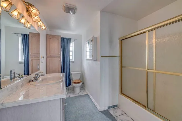 a view of room with ceiling fan and window