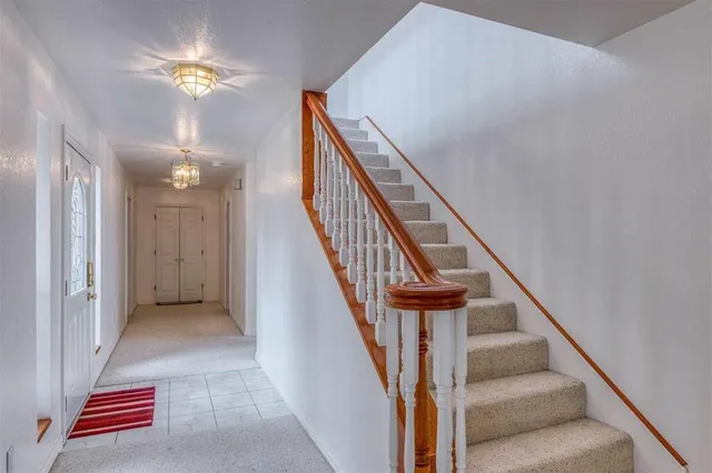 a view of water heater room with a hallway