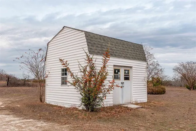 a view of a lake with a yard